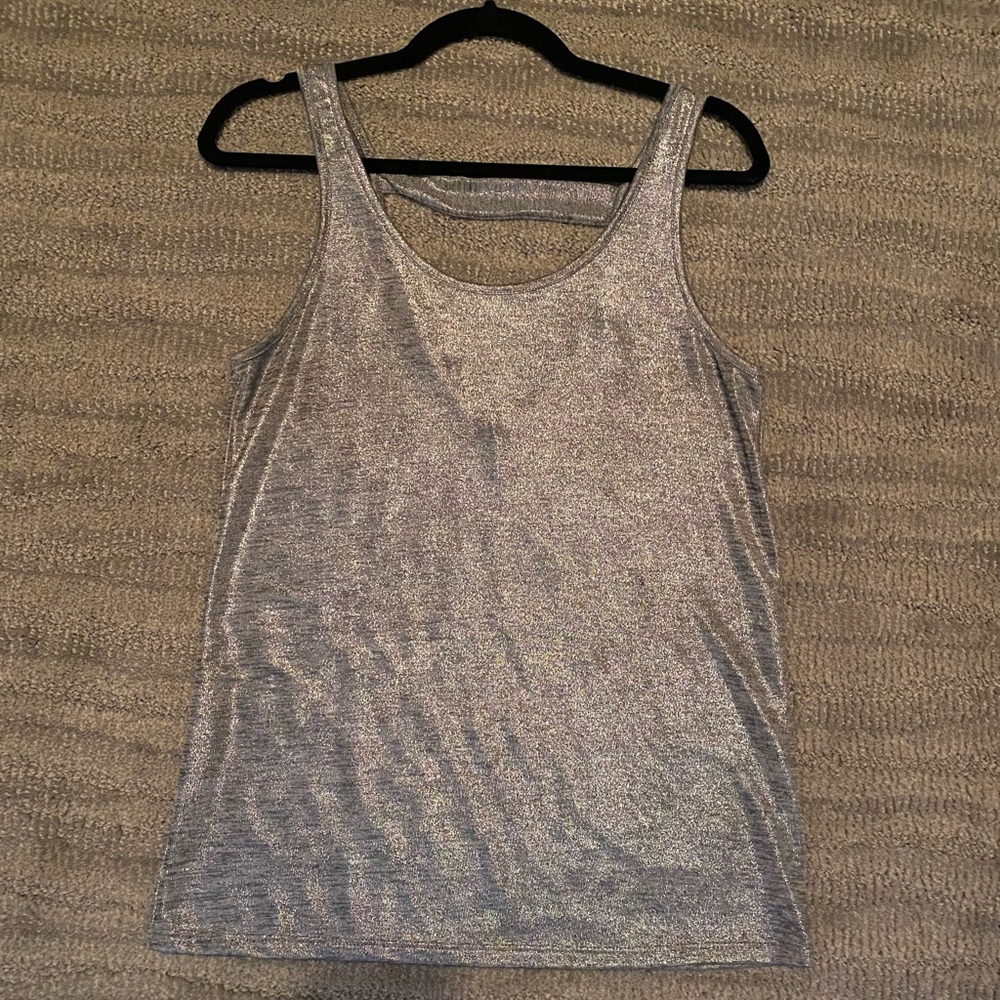 Shiny silver sleeveless top.